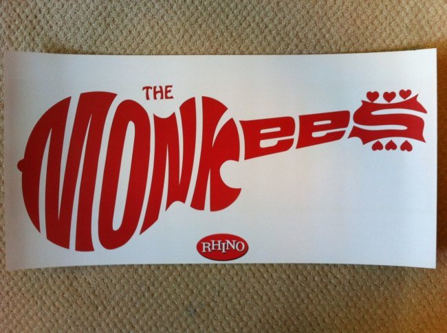 The Monkees Guitar Icon Poster: A great icon of the 70s - the Monkees Guitar Logo Poster. Back side has images of the Monkeys and three album covers. Heavy matte stock. about 11" x 28"