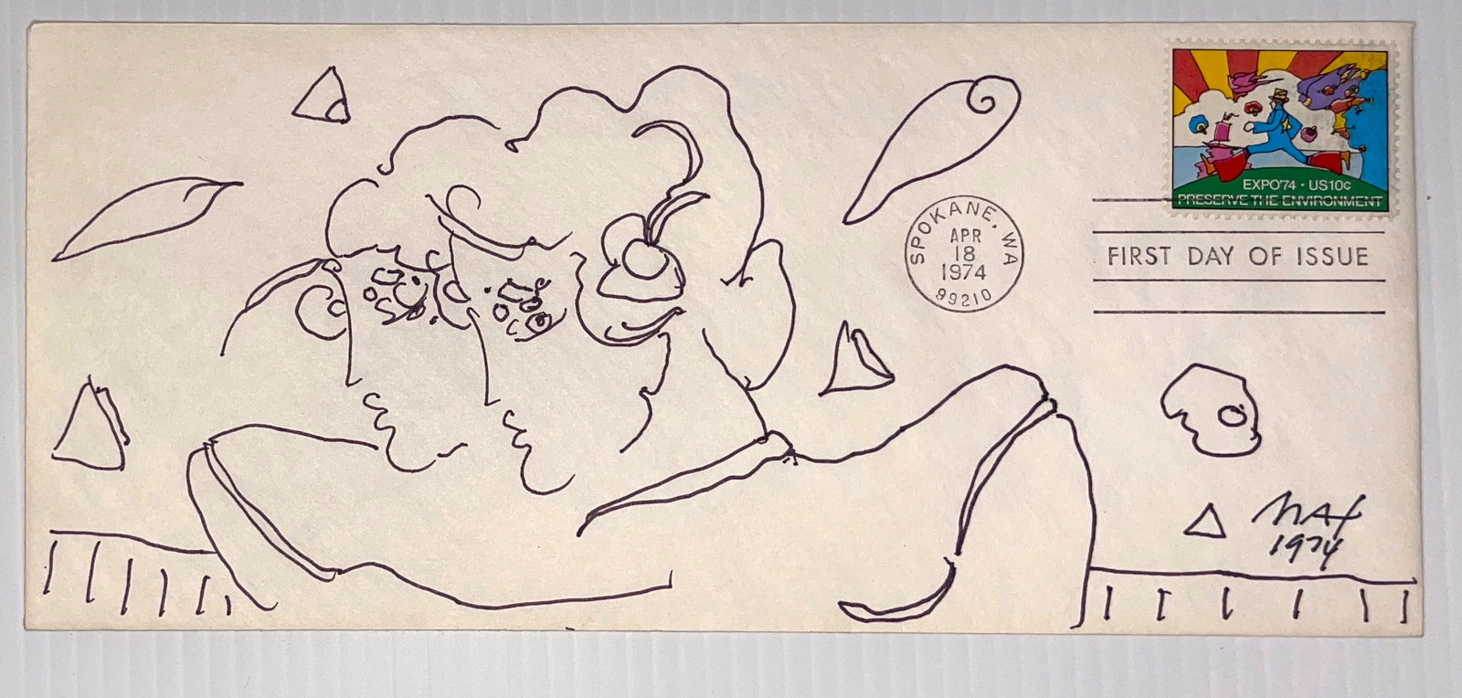 1974 PETER MAX FIRST DAY ISSUE STAMP AND ORIGINAL ART: 1974 PETER MAX FIRST DAY ISSUE STAMP AND ORIGINAL ART by Peter Max. With COA from Peter’s 50 year business partner. Envelope is 9 x 4 and has original color drawing by Peter Max. 1974 First Day issu