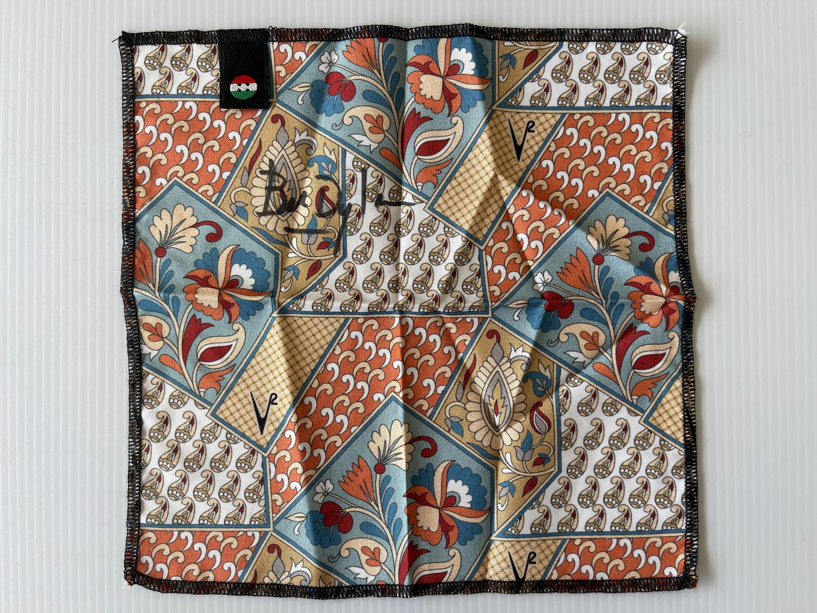 BOB DYLAN SIGNED POCKET SQUARE: BOB DYLAN SIGNED HANDKERCHIEF. ABOUT 6 X 6. Real. Really... REAL.