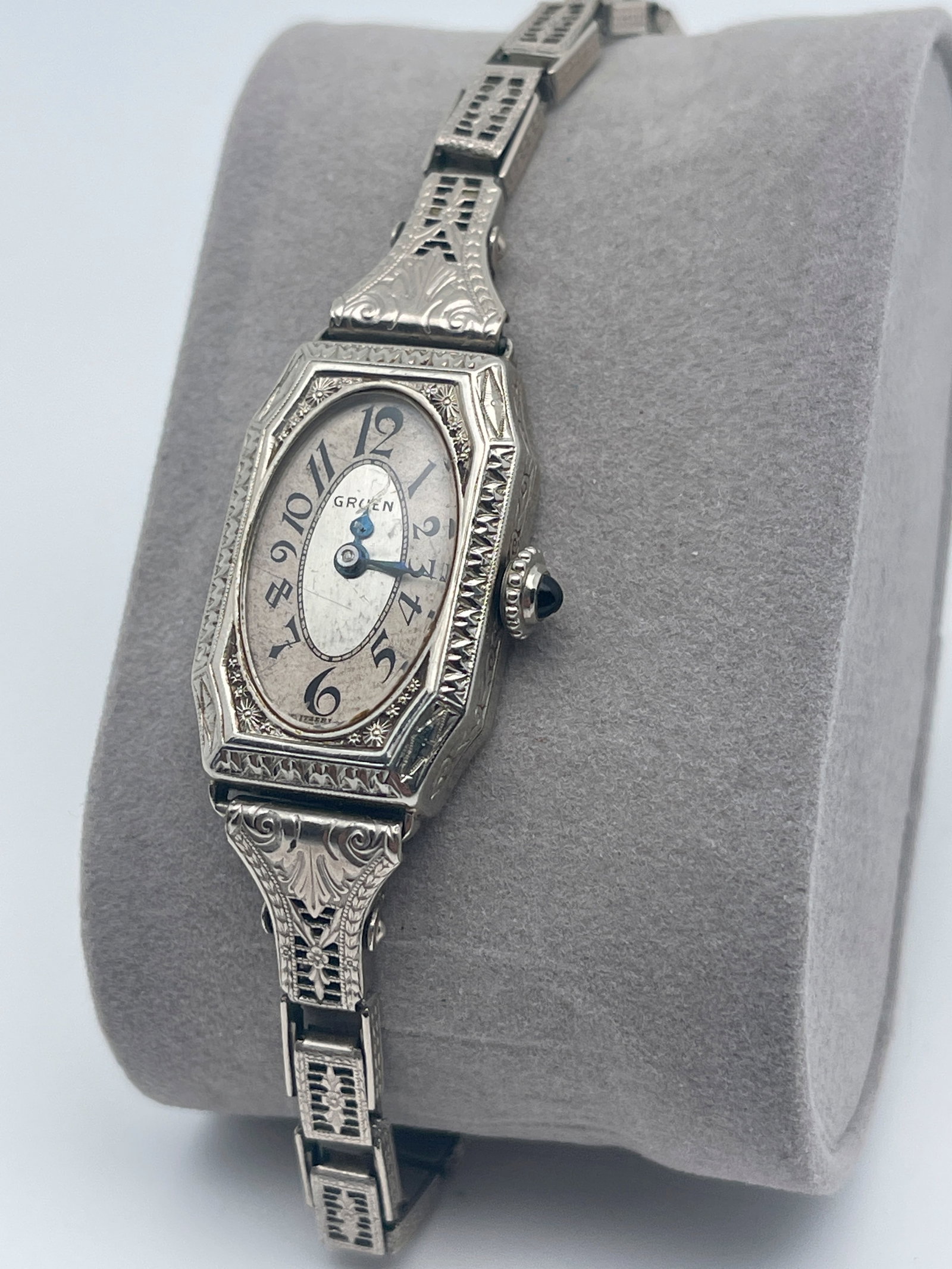 BEAUTIFUL GRUEN ART DECO WOMENS WATCH: BEAUTIFUL GRUEN ART DECO WOMENS WATCH. STURDY MAID 12K STRETCH BRACELET. BLUE GEM ON CROWN. HANDS MOVE FREELY. UNTESTED SOLD AS IS. NO TICKING SOUND. OUR FAVORITE WATCH WITH THE ORNATE ETCHINGS ON CAS