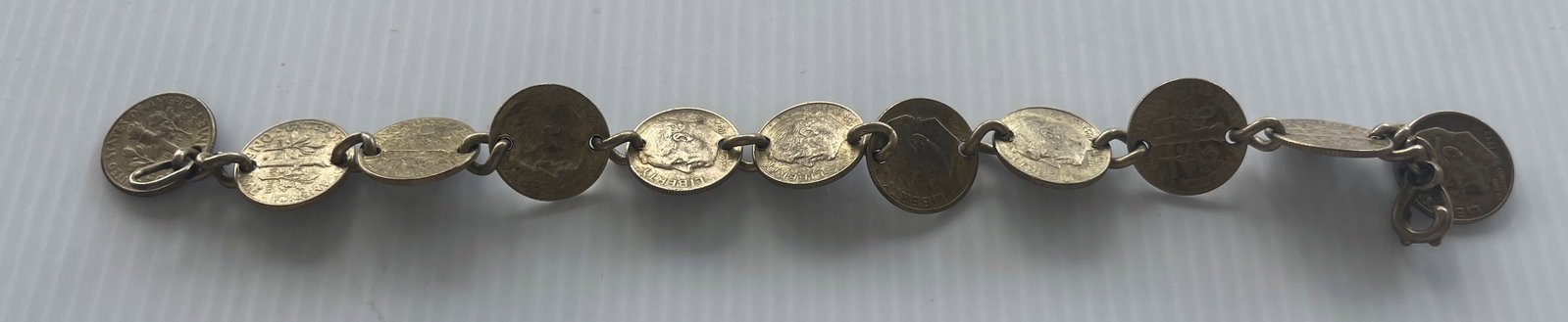 DIME BRACELET: 11 SILVER DIMES. about 9 inches long.