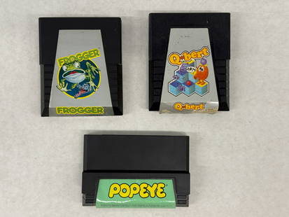 FROGGER AND Q*BERT GAME CARTS: FROGGER AND Q*BERT GAME CARTS WITH ADDED POPEYE GAME.