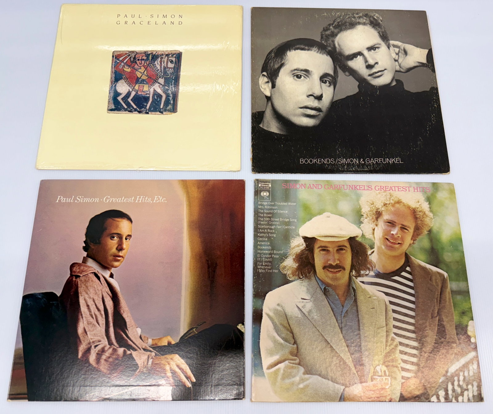 PAUL SIMON AND MORE: PAUL SIMON AND MORE WITH GRACELAND. BOOKENDS. GREATEST HITS. SIMON AND GARFUNKEL.
