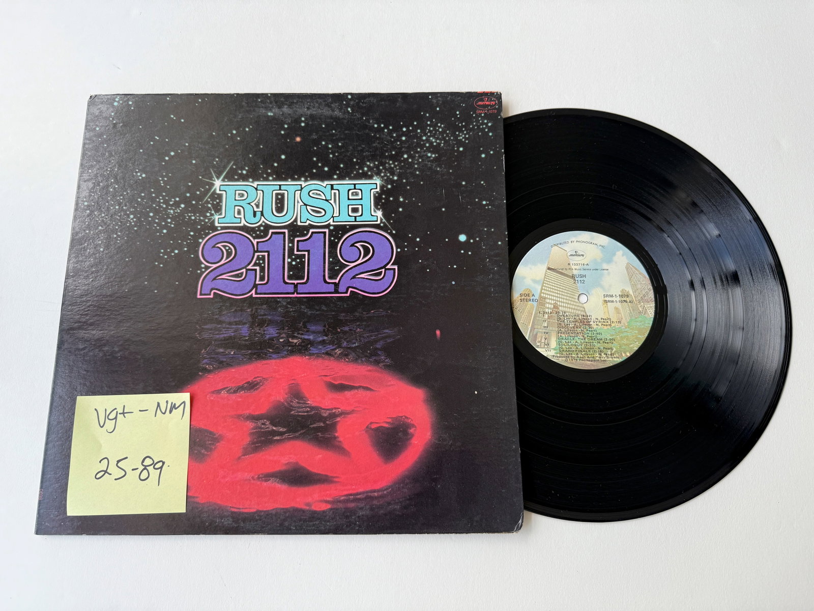 Rush - 2112: Rush - 2112. Mercury - SRM-1-1079. Skyscraper label version with perimeter text on top
