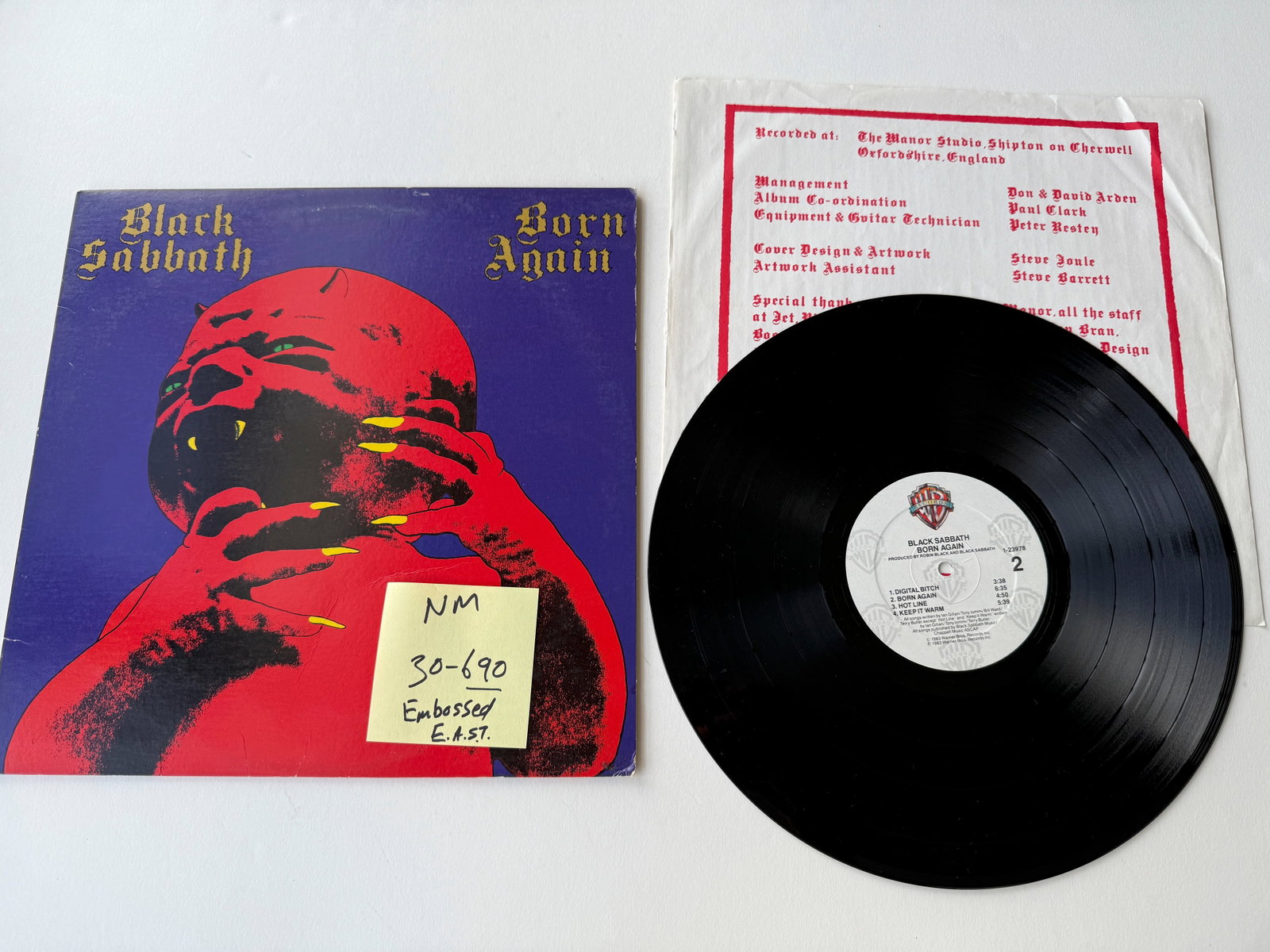 Black Sabbath - Born Again "E.A.S.T." embossed around the center hole: Black Sabbath - Born Again. MATRIX: B-18603 1-23978 A-SHi 0-2. Specialty Records Corporation pressing identified by "E.A.S.T." embossed around the center hole, with metal parts manufactured by Sheffie