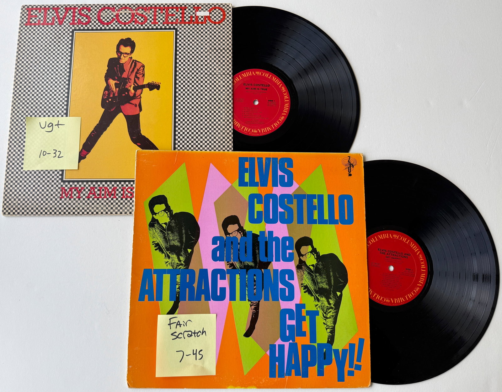 Elvis Costello - My Aim Is True and Get Happy: Elvis Costello - My Aim Is True and Get Happy. Columbia - JC 35037. Elvis Costello is backed by American band Clover (The group is most well known outside the US for their version of Route '66 in the 
