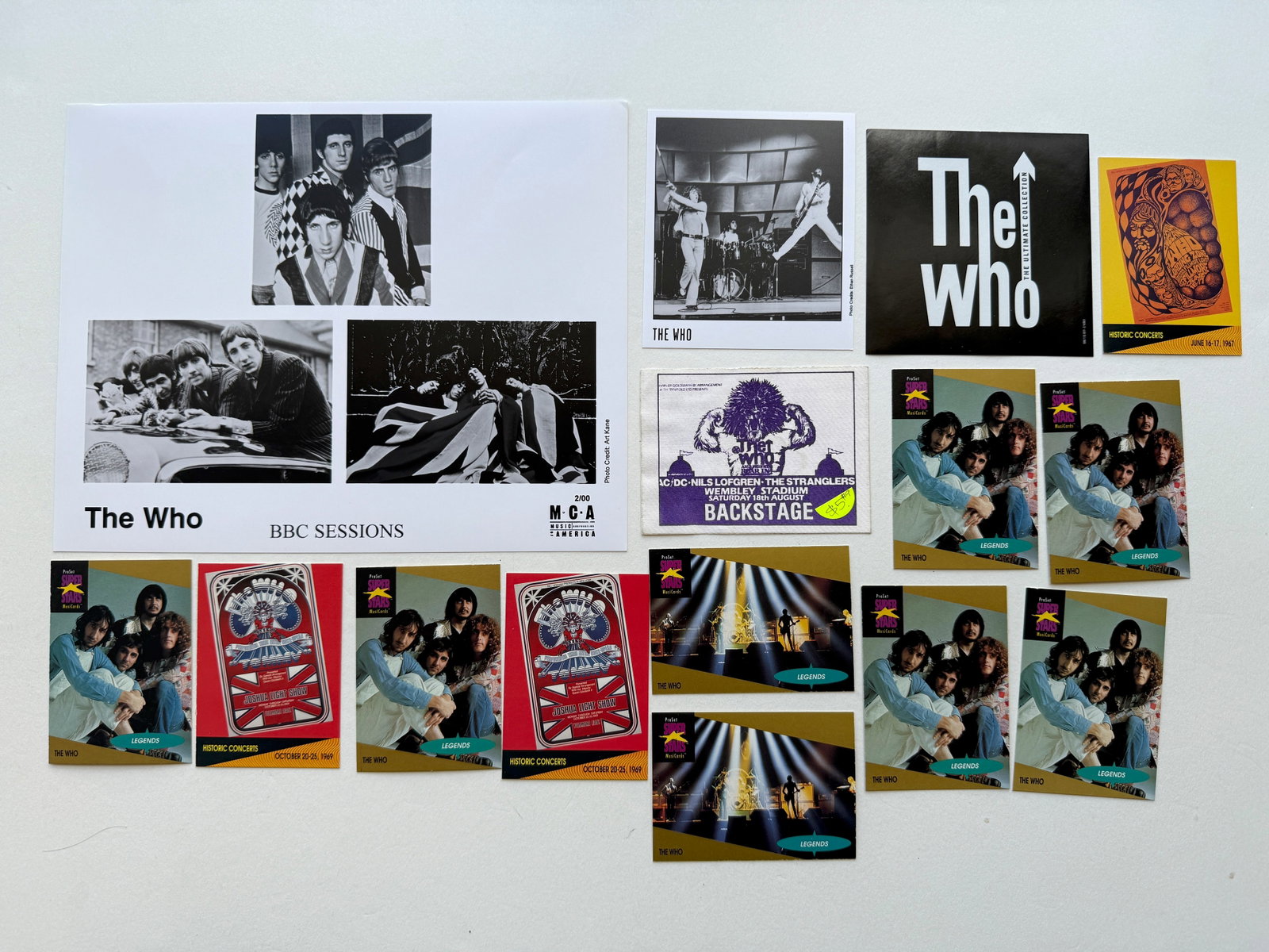 THE WHO SET: PRESS PHOTOS, BACKSTAGE PASS, STICKERS AND CARDS. SUITABLE FOR FRAMING. EACH SET MAY CONTAIN BOOKPLATES, STICKERS, TRADING CARDS, POSTCARDS, PHOTOS, BACKSTAGE PASSES, TICKET STUBS, PRESS PHOTOS AND OT