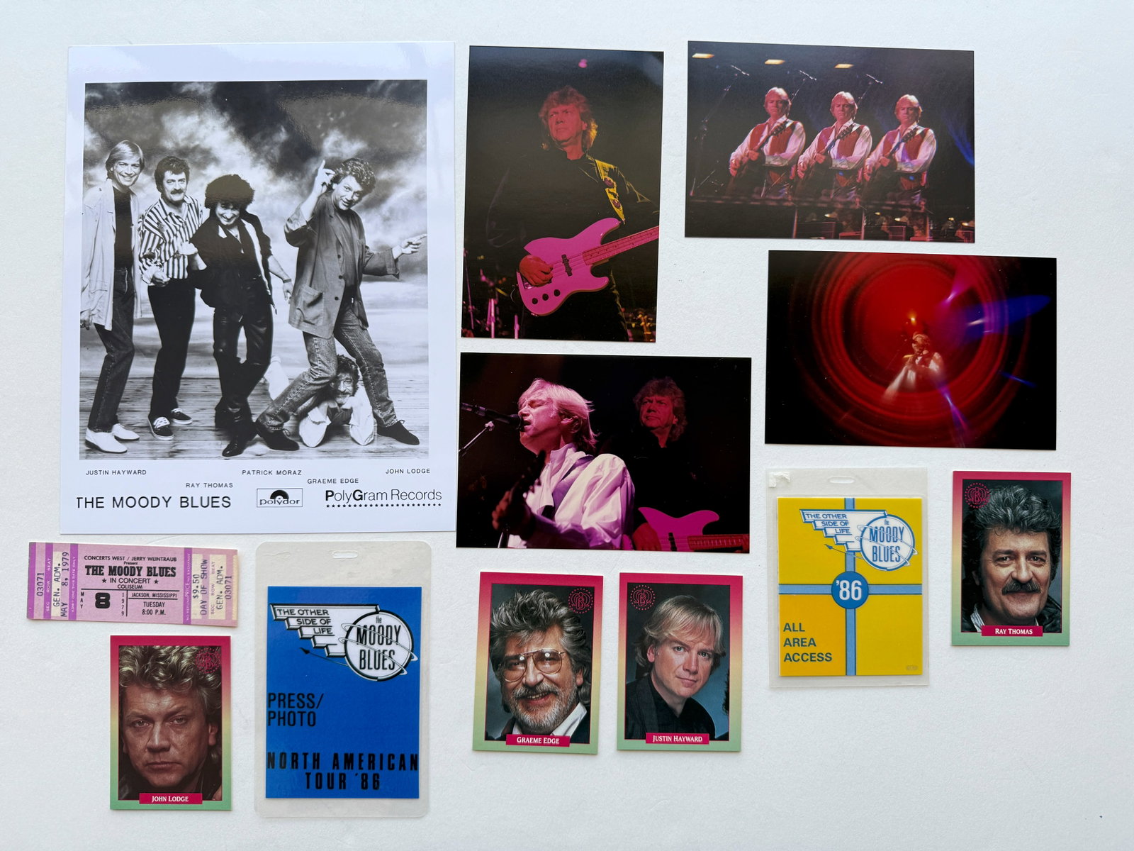 MOODY BLUES SET: PRESS PHOTO, BACK STAGE PASSES, CARDS, PHOTOS, TICKET STUB. SUITABLE FOR FRAMING. EACH SET MAY CONTAIN BOOKPLATES, STICKERS, TRADING CARDS, POSTCARDS, PHOTOS, BACKSTAGE PASSES, TICKET STUBS, PRESS PHO