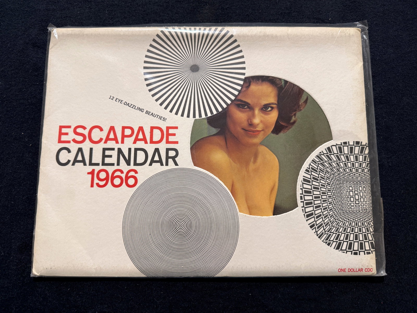 1966 ESCAPADE CALENDAR - WITH PIN-UPS AND BEAUTIES: A MAIL ORDER RARITY - NEARLY PERFECT ! 1966 ESCAPADE CALENDAR - WITH PIN-UPS AND BEAUTIES. MINT. NEVER USED. FOLDED AS DISTRIBUTED. AMAZING HISTORICAL REFERENCE. A 1966 calendar can be reused in years