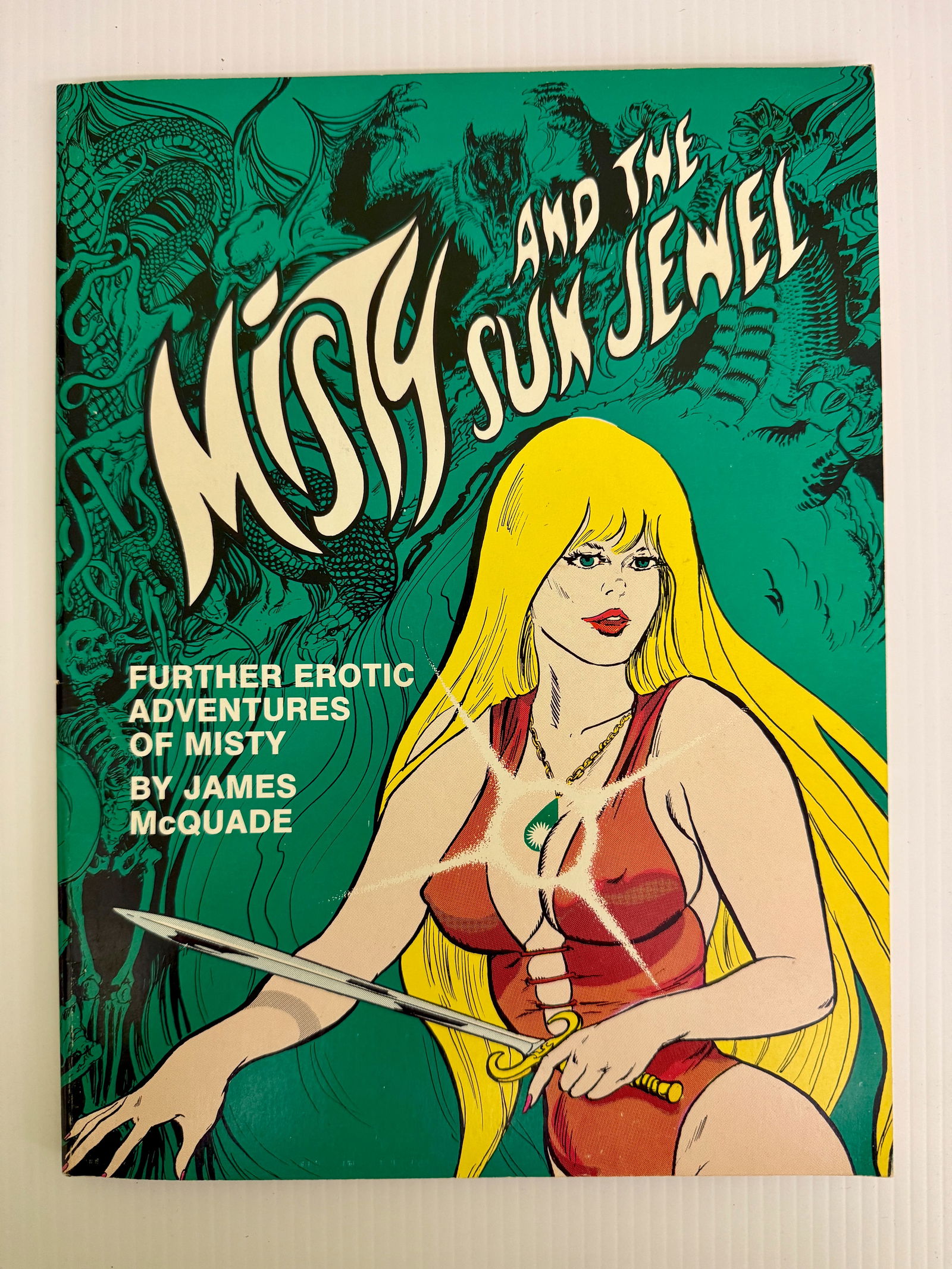 MISTY AND THE SUN JEWEL. ADULT GRAPHIC COMIC NOVEL: MISTY AND THE SUN JEWEL. ADULT GRAPHIC COMIC NOVEL. FURTHER EROTIC ADVENTURES OF MISTY BY JAMES McQUADE. ADULTS 18 AND POVER ONLY. 1983 NUANCE, INC. EROTIC SCIENCE FICTION. Misty and the Sun Jewel is