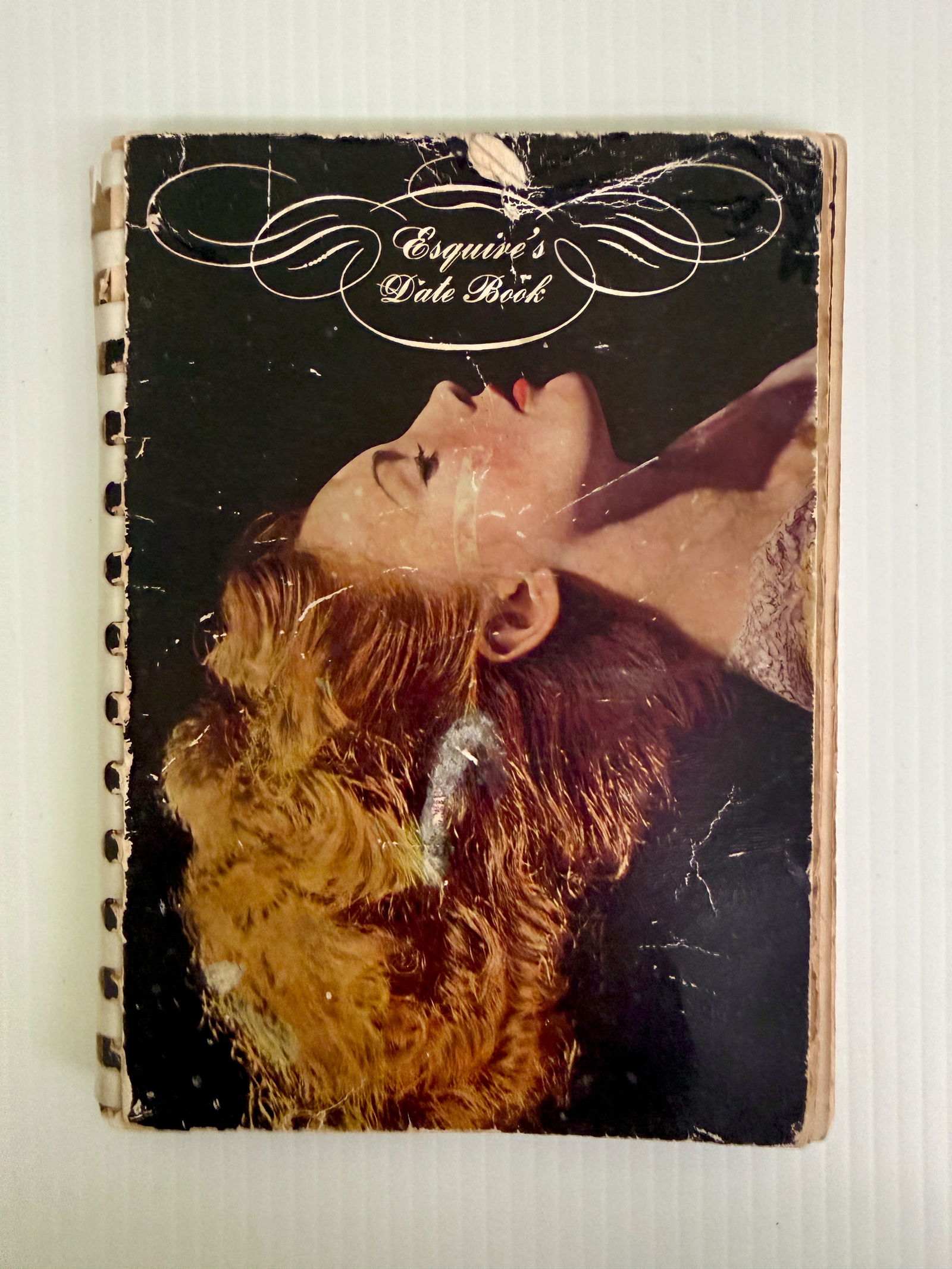 ESQUIRE MAGAZINE DATE BOOK - WITH CENTERFOLD-STYLE PAGES: ESQUIRE MAGAZINE DATE BOOK - WITH CENTERFOLD-STYLE PAGES. CALENDAR DATEBOOK HAS ENTRIES FROM FIRST DATE FROM 1943 1944 AND OTHER SPECIAL NOTES FROM OWNER. IMAGES OF FAMOUS WOMEN INCUDING RITA HAYWORTH