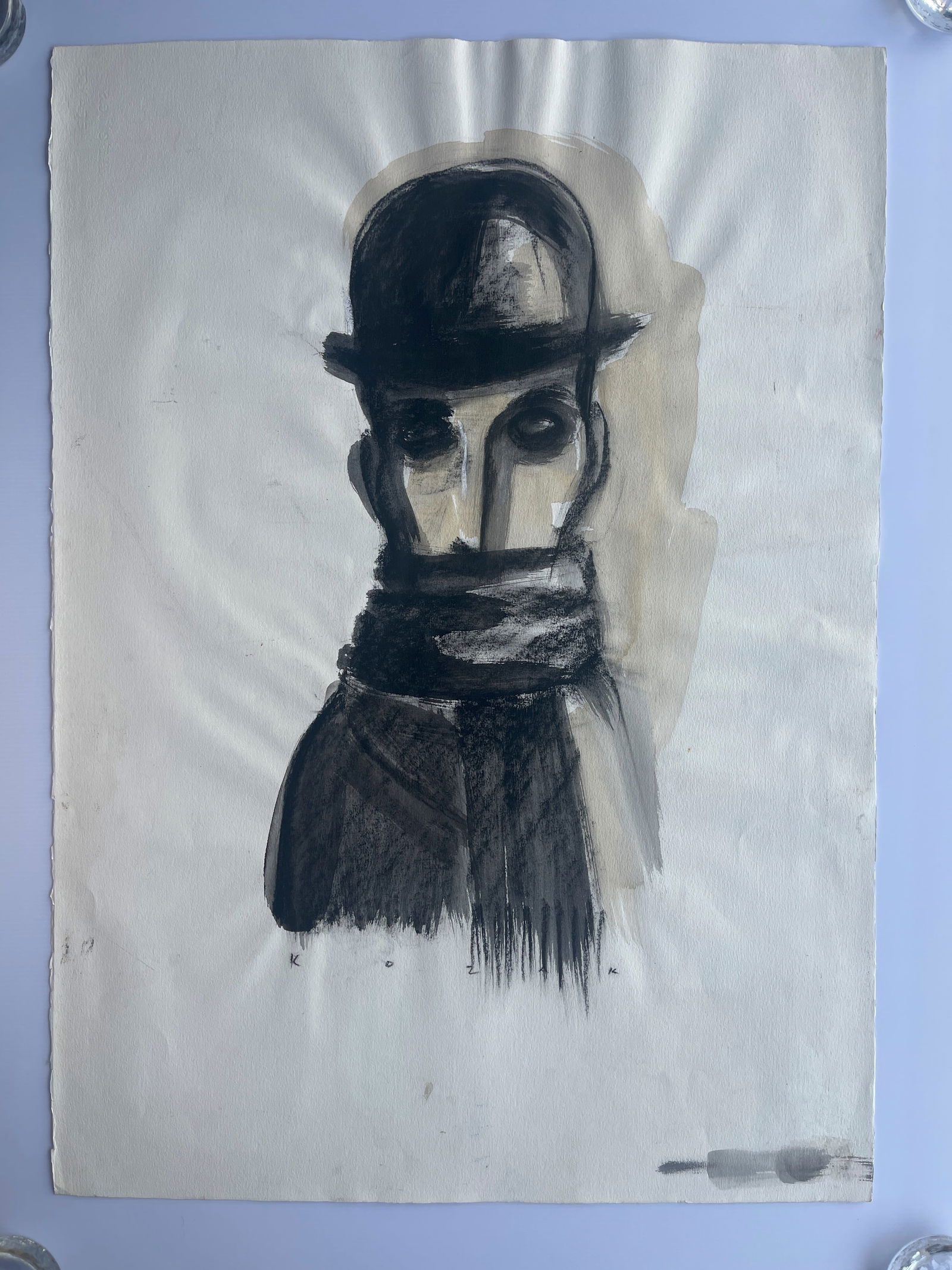 Watercolor drawing of a man in a bowler hat: modernist or expressionist style watercolor drawing of a man in a bowler hat and scarf, possibly a self-portrait or character study. The drawing is executed in charcoal and watercolor on paper, and th