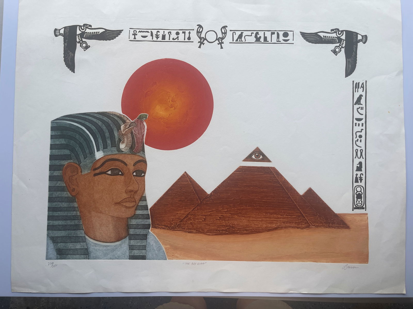 The Boy King - O’Brian: This artwork is an original print titled "The Boy King" by an artist named O'Brian. Artwork Details Subject: The print is a figurative depiction of the Egyptian Pharaoh Tutankhamun, commonly known as