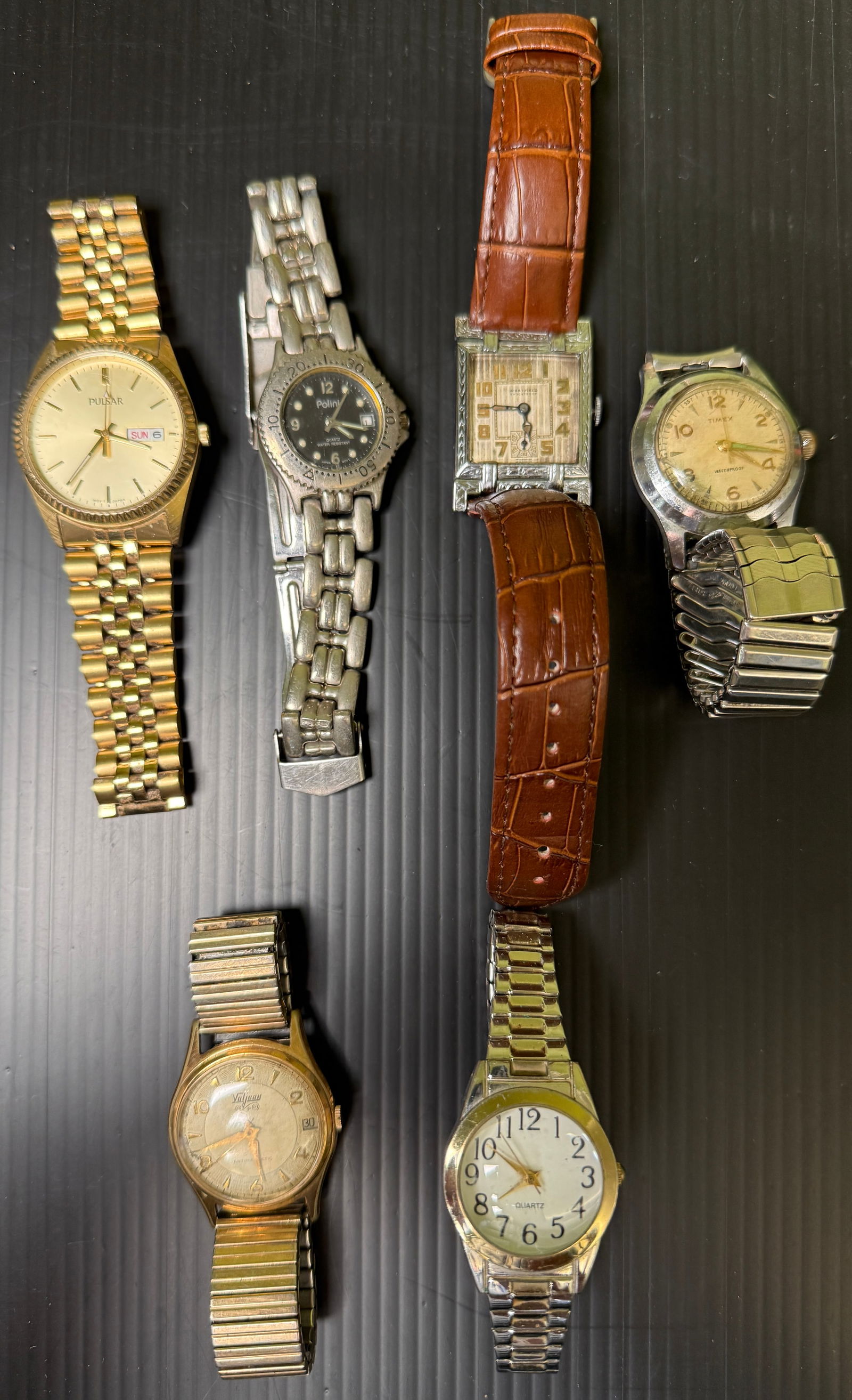 MENS VINTAGE WATCH ASSORTMENT: MENS VINTAGE WATCH ASSORTMENT. SOLD AS IS OF COURSE. BRANDS INCLUDE PULSAR, POLINI. WESTFIELD (WORKING AT TIME OF LISTING), TIMEX, VALJEAN, AND ANOTHER OFF-BRAND.