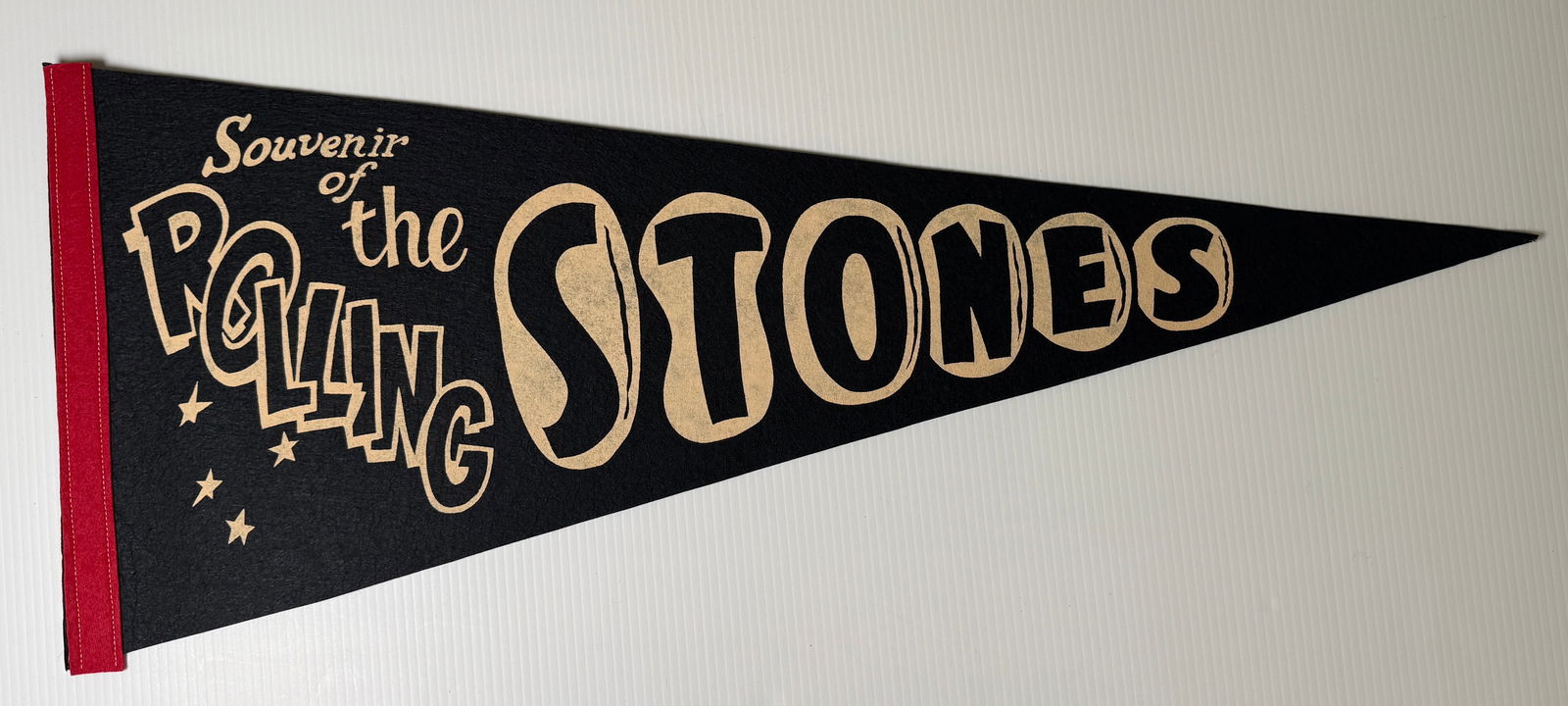 SOUVENIR OF THE ROLLING STONES FLAG PENNANT - 1970 ORIGINAL NOS: NEW OLD STOCK. about 30 inches wide. purchased the entire contents of this business that closed in the 70's. These never saw the light of day !