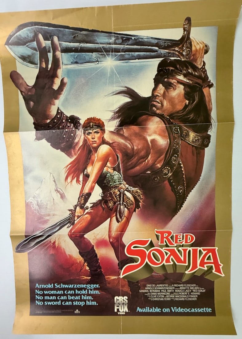 RED SONJA - ARNOLD SCHWARZENEGGER: RED SONJA - ARNOLD SCHWARZENEGGER. VIDEO CASSETTE RELEASE PROMO. ABOUT 18 X 24. FOLDED AS DISTRIBUTED