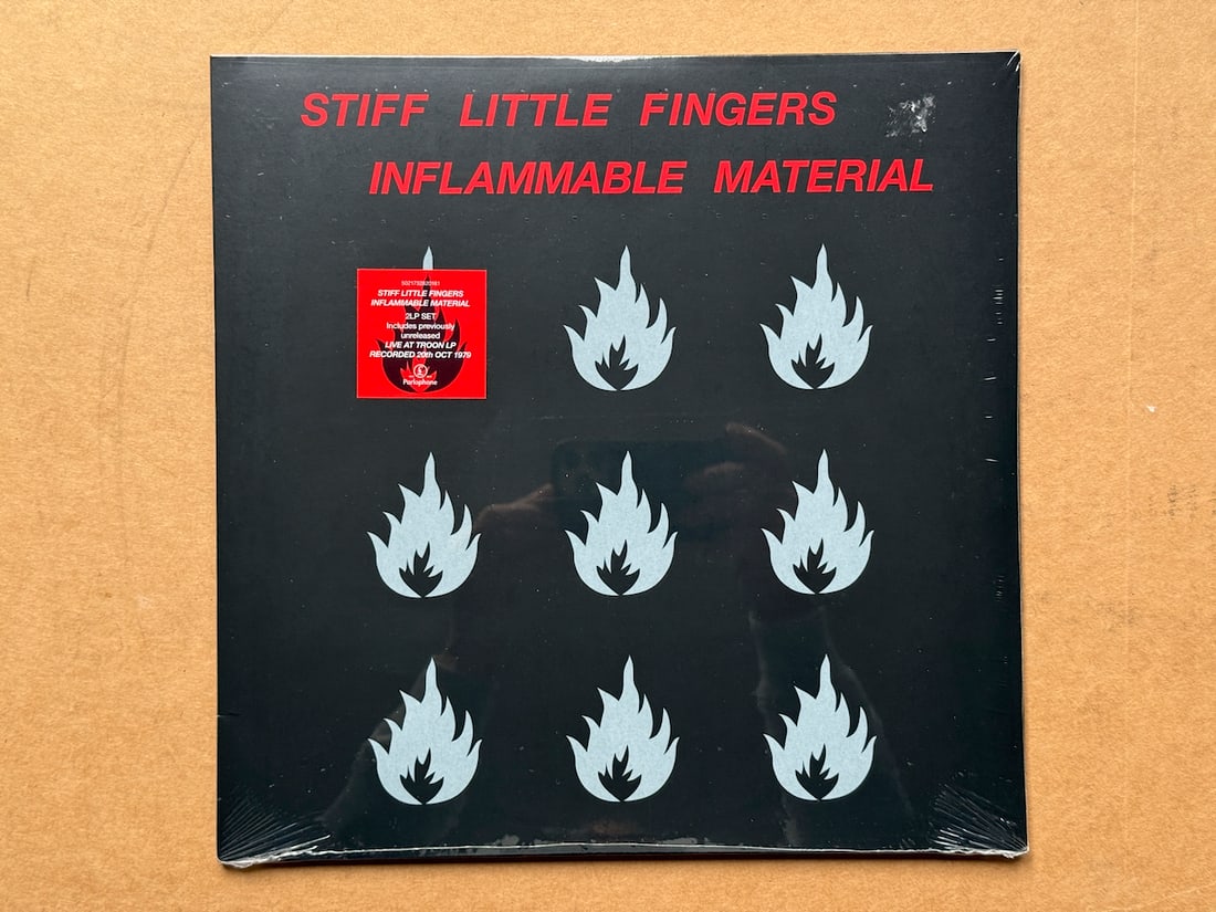 Stiff Little Fingers - Inflammable Material - SEALED: Stiff Little Fingers - Inflammable Material - SEALED. Northern Irish punk band formed around 1977, the original members being Jake Burns, Ali McMordie, Henry Cluney & Brian Faloon