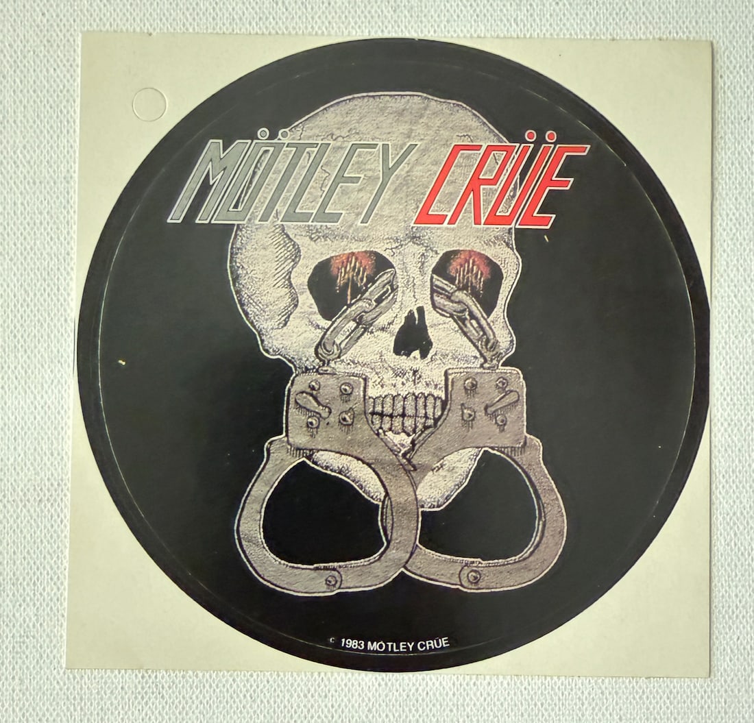 1983 MOTLEY CRUE STICKER and BACK STAGE PASS: 1983 MOTLEY CRUE sticker - about 6" across. Winterland Productions.1983 MOTLEY CRUE STICKER and BACK STAGE PASS