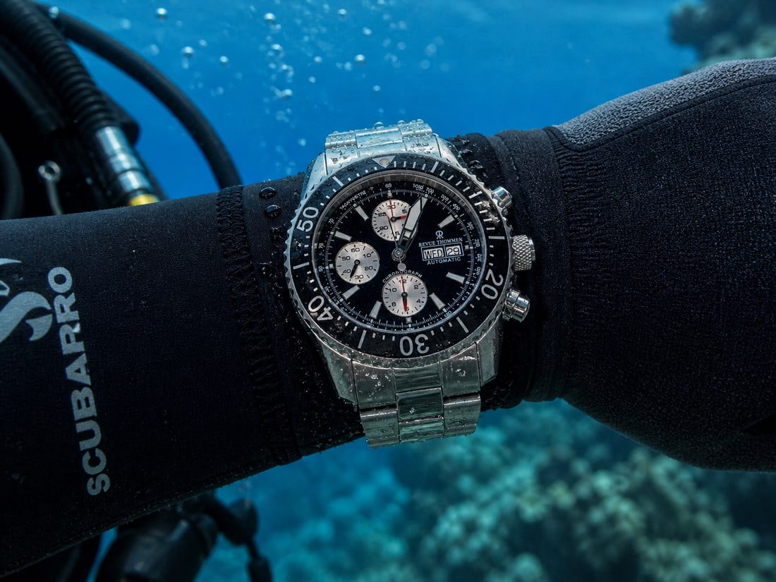Revue Thommen Men's 17030.6137 'Air Speed' Black Dial Stainless Steel Chronograph Swiss Automatic: The Revue Thommen Diver Chronograph is a Swiss-made automatic timepiece featuring a stainless steel case and bracelet, water resistance up to 300 meters, and a chronograph function with day-date displ