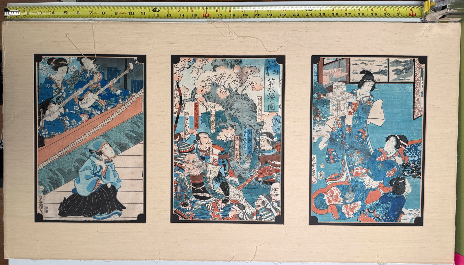 Japanese woodblock triptych - Utagawa Kunisada (Toyokuni III): This Japanese woodblock print triptych (three panels) depicts a scene likely from a kabuki play or historical narrative, common subjects for this medium. The text visible in a cartouche on the center 