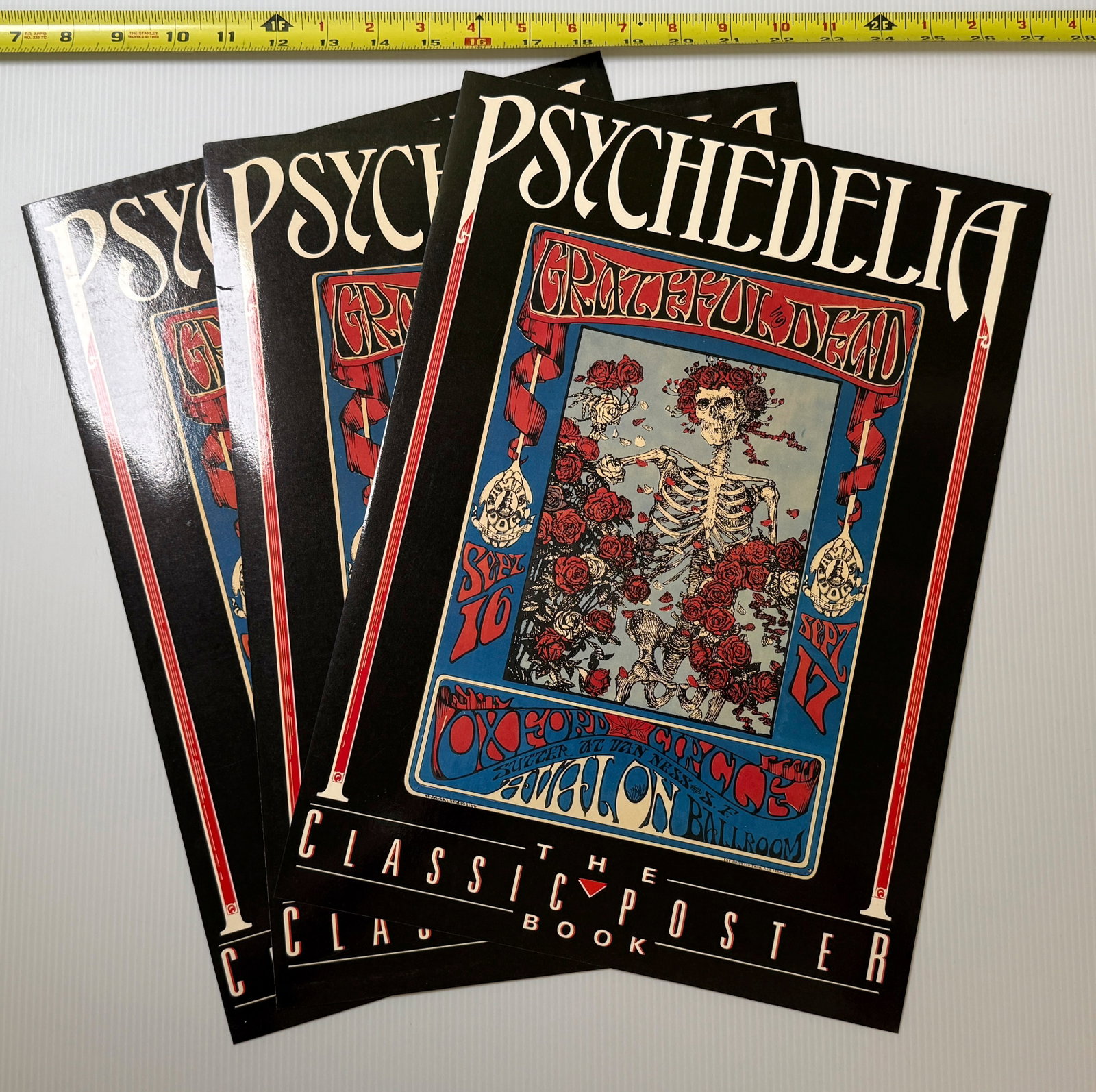 THREE BOOK COVERS FROM PSYCHEDELIA POSTER BOOK: THREE BOOK COVERS FROM PSYCHEDELIA POSTER BOOK FEATURING STANLEY MOUSE SKULL AND ROSES. SUITABLE FOR FRAMING.