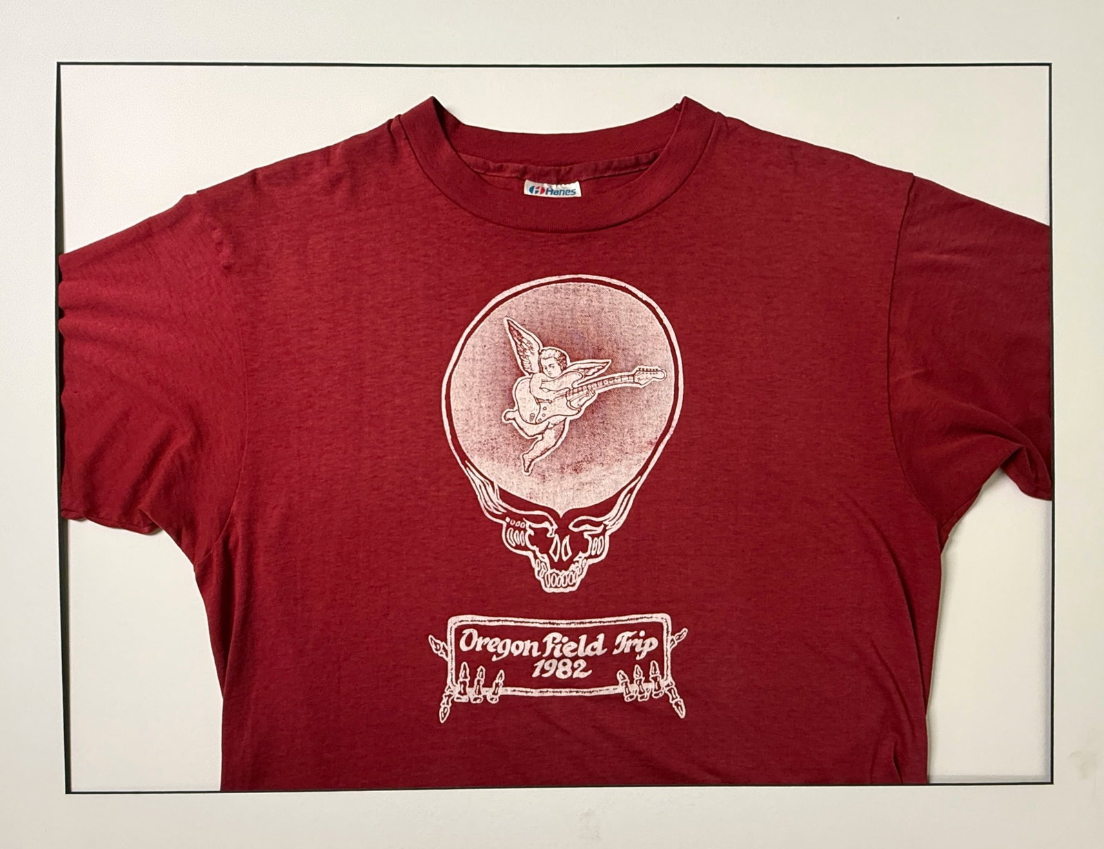 1982 GRATEFUL DEAD OREGON FIELD TRIP TOUR T-SHIRT: 1982 GRATEFUL DEAD OREGON FIELD TRIP TOUR T-SHIRT. SIZE XL. STEAL YOUR FACE LOGO WITH GUITAR PLAYING CHERUB. The Grateful Dead's 1982 Oregon "Field Trip" took place on August 28, 1982, at the Oregon C