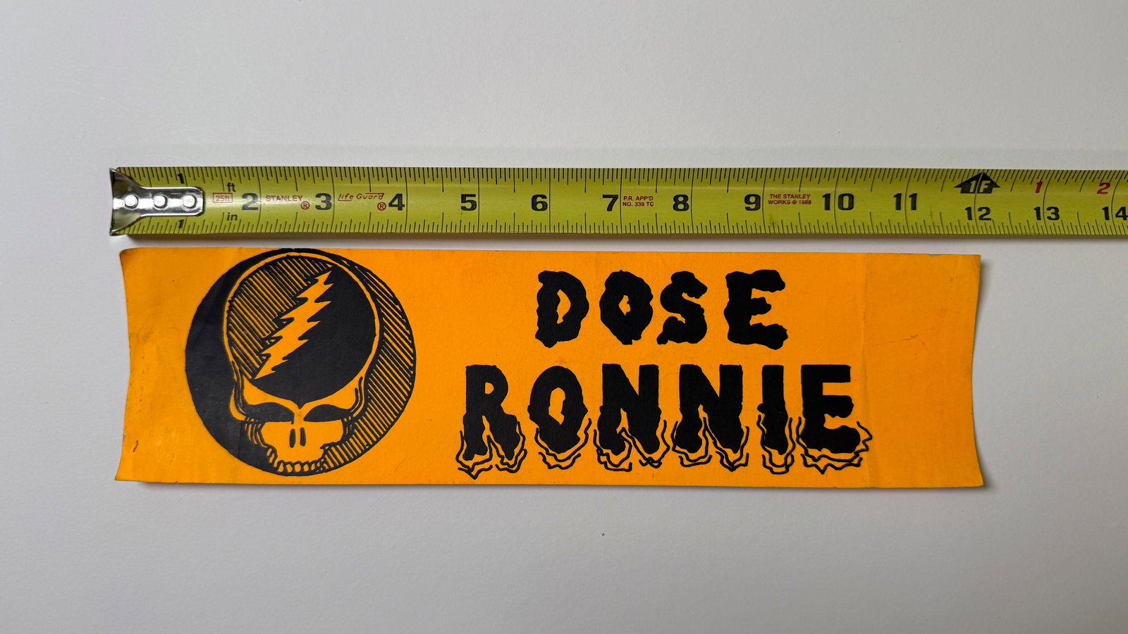 DOSE RONNIE - RONALD REAGAN BUMBER STICKER: "Dose Ronnie" was a popular political slogan and patch/button seen on the Grateful Dead lot during the 1980s, referring to President Ronald Reagan. It was a satirical play on the 1980s "Just Say No"