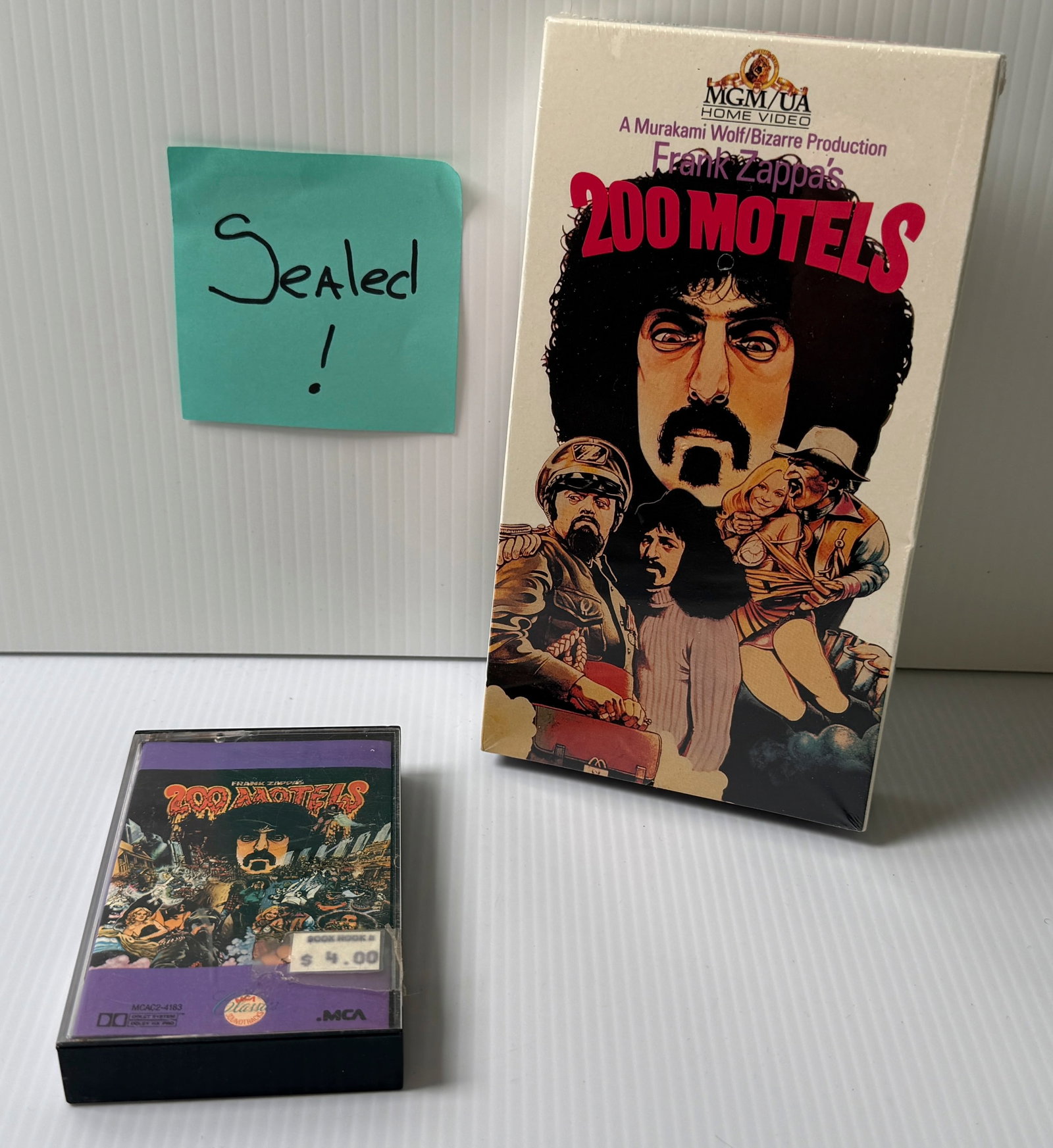 200 MOTELS - FRANK ZAPPA - SEALED VHS AND MUSIC CASSETTE.: 200 MOTELS - FRANK ZAPPA AND RINGO STARR - SEALED VHS AND MUSIC CASSETTE. VHS FROM 1988. SEALED. CASSETTE OPEN IN NM CONDITION.