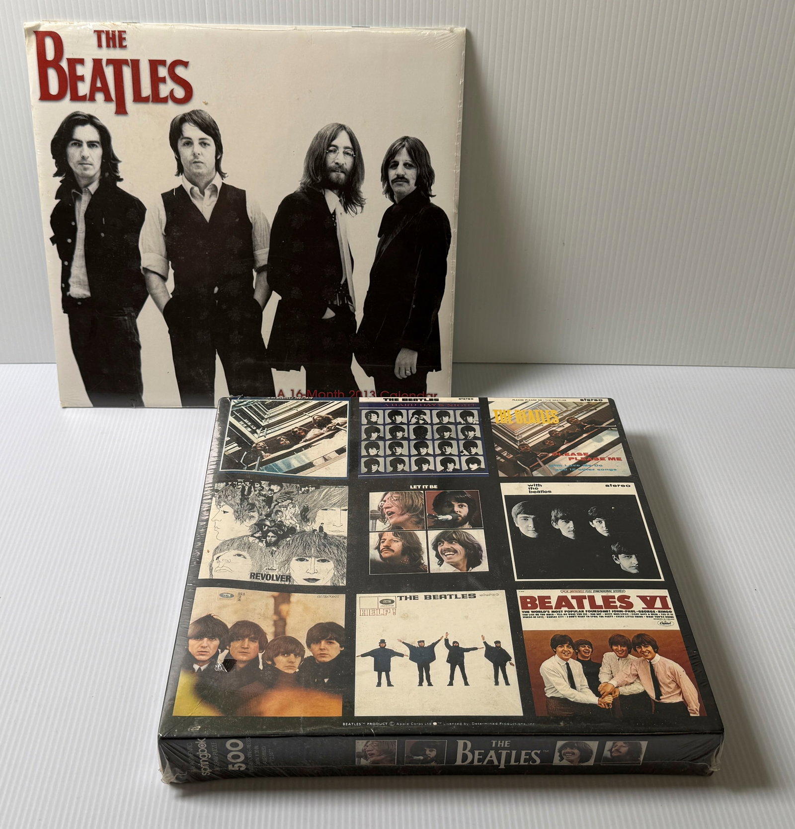 BEATLES ALBUM COVER 500 PIECE PUZZLE - SEALED: BEATLES ALBUM COVER 500 PIECE PUZZLE - SEALED. INCLUDES SEALED 2013 CALENDAR WITH MANY FRAMABLE IMAGES ! CAN BE USED AS A CALENDAR IN 2030 OR FOR AMAZING IMAGES.