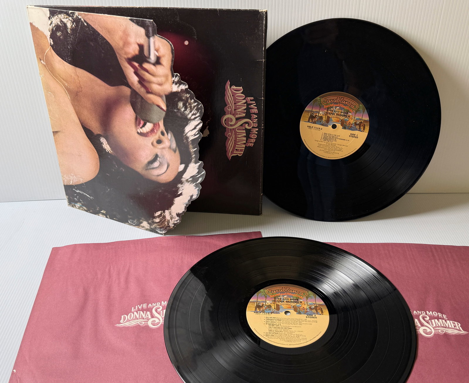 DONNA SUMMER - LIVE AND MORE: DONNA SUMMER - LIVE AND MORE. DOUBLE ALBUM SET. DIE-CUT COVER. COVER IS WATER STAINED AND PAPER LOSS. ALBUMS ARE VG++ ($20)