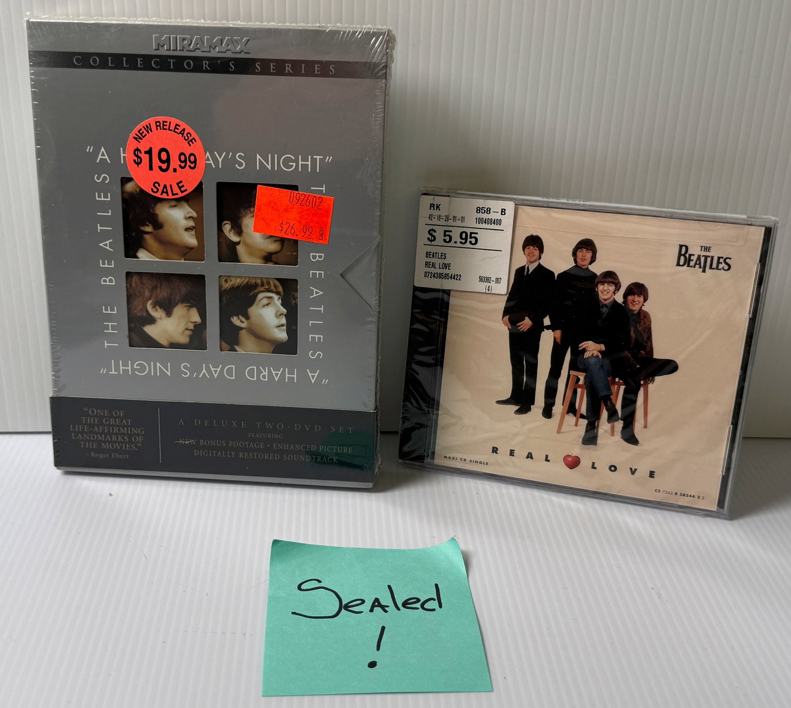 A HARD DAY’S NIGHT - THE BEATLES SEALED DVD & REAL LOVE CD - SEALED: A HARD DAY’S NIGHT - THE BEATLES SEALED DVD & REAL LOVE CD - SEALED ($50-$100).