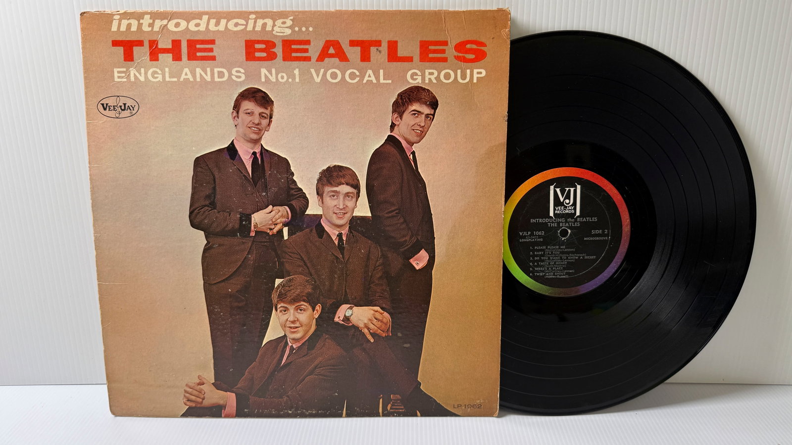 INTRODUCING THE BEATLES - OFFICIAL - WITH GEORGE SHADOW: INTRODUCING THE BEATLES - OFFICIAL - WITH GEORGE SHADOW ($20-$40). on Vee-Jay Rainbow label. Awesome Cover.