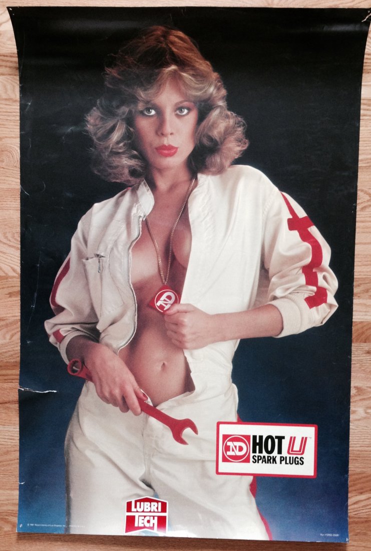 A COLLECTION OF GARAGE GALS: A COLLECTION OF GARAGE GALS POSTER topped off by a VINTSGE - MINT - HUSQVARNA 1970's POSTER woman with chainsaw. Varios conditions. ND Nippondenso Hot U Spark Plugs. One poster signed by Lisa Lee.. ND