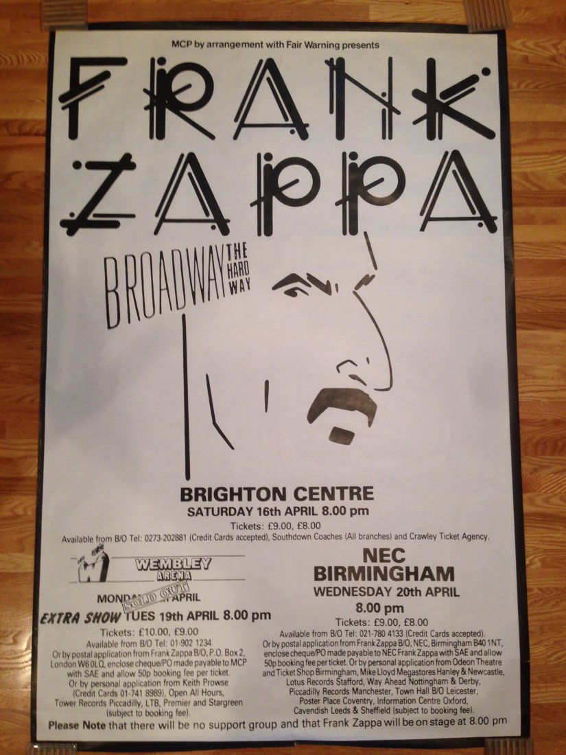 FRANK ZAPPA BROADWAY THE HARD WAY POSTER: This poster is EXTREMELY RARE. It is a poster used to promote Zappa's Broadway The Hard Way European Tour...It is NEAR MINT!!! Minor small tears in border. Venues are Wembley Arena, Brighton Centre an