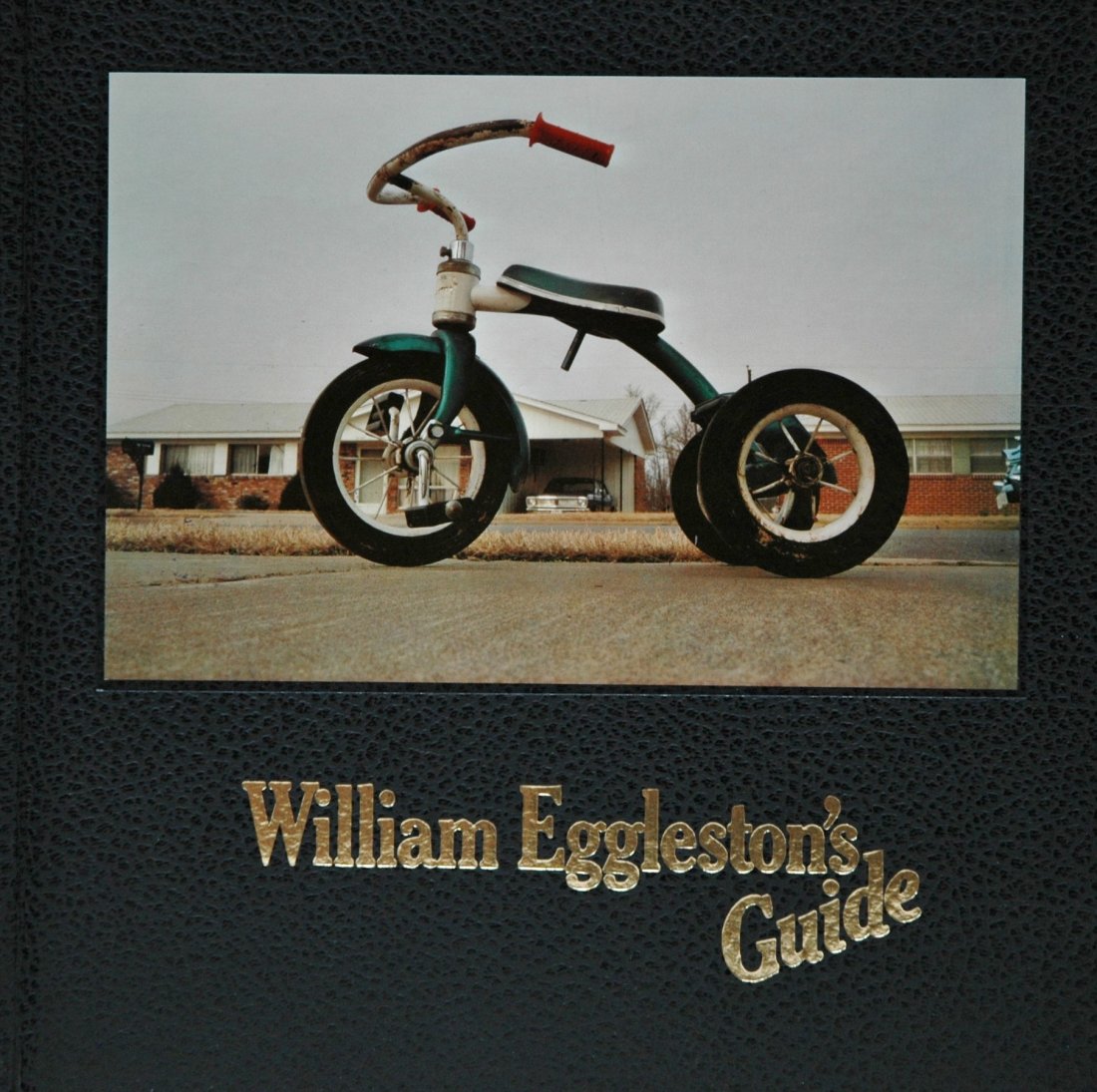 EGGELSTON, William. Guide. MoMA 1976: EGGELSTON, William. William Eggleston's Guide, New York: Museum of Modern Art, 1976. Hardcover (gold-stamped leatherette with mounted reproduction), 9 ¼ x 9 ¼ inches, 112 pages, 94 color halftone il