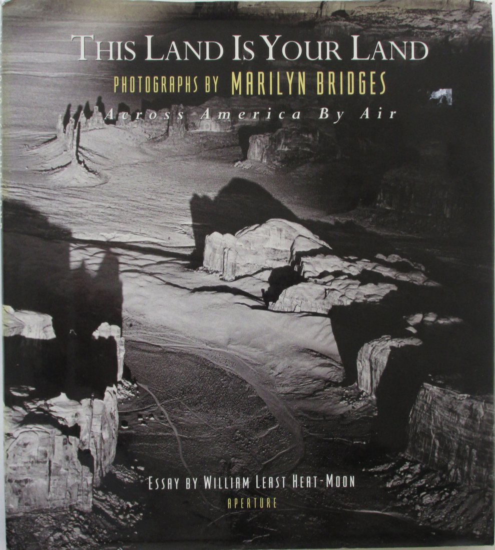 Bridges, Marilyn - This land is your land: Across: Bridges, Marilyn - This land is your land: Across America by Air - Aperture - 1997 1st ed. vg. DJ edges slightly curled at front top.