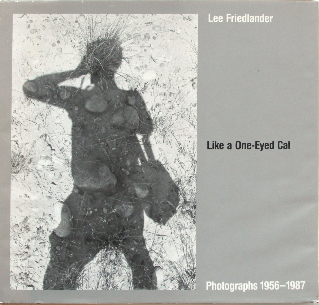 Friedlander, Lee - Like a One-Eyed Cat: Photographs: Friedlander, Lee - Like a One-Eyed Cat: Photographs 1956-1987 - Abrams - 1989. VG. DJ minor edge wear, fading.Flyleafs have age yellowing.