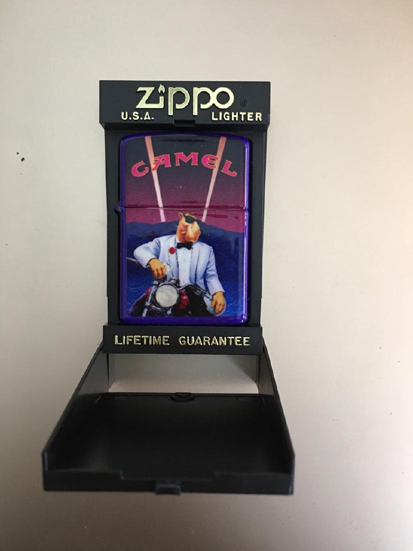 ZIPPO LIGHTER WITH JOE CAMEL CIGARETTE ADVERTISING: ZIPPO LIGHTER WITH JOE CAMEL CIGARETTE ADVERTISING. IN ORIGINAL CASE.