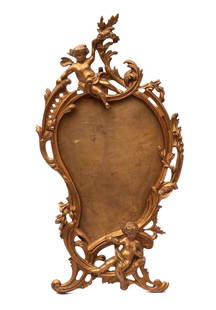 Standspiegelrahmen, 2. Hälfte 19.Jhdt.: Bewegte, durchbrochen gearbeitete Rokokoforn mit plastischen Putti, Blattwerk und Rocaillen. Metallguss, bronziert. H.40cm. Spiegel fehlt.