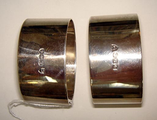 Pr Sterling Silver Napkin Rings Sheffield 1934: A PAIR OF STERLING SILVER NAPKIN RINGS These napkin rings date to 1934, the maker is LA and the hallmarks resolve to Sheffield. They measure 2.25" x 1" and are in fine condition, free from dents. As a
