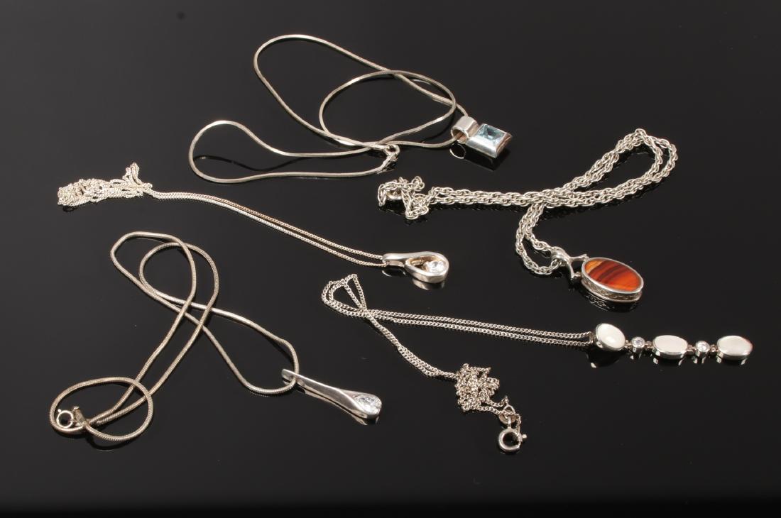 Five silver pendants on chains. (1 of 1)