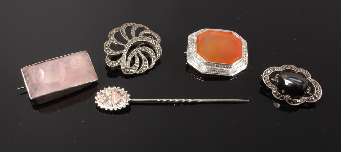 A gold applied stick pin and four silver brooches (1 of 1)