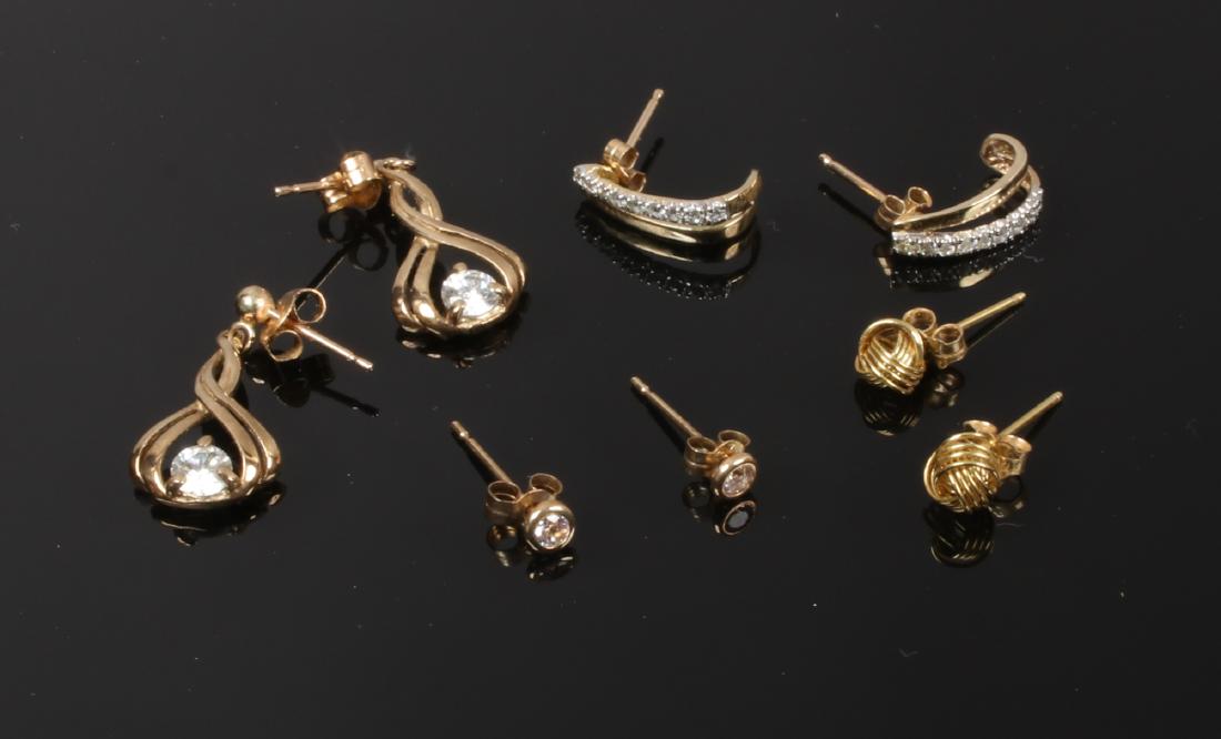 Four pairs of 9ct gold earrings including white paste (1 of 1)