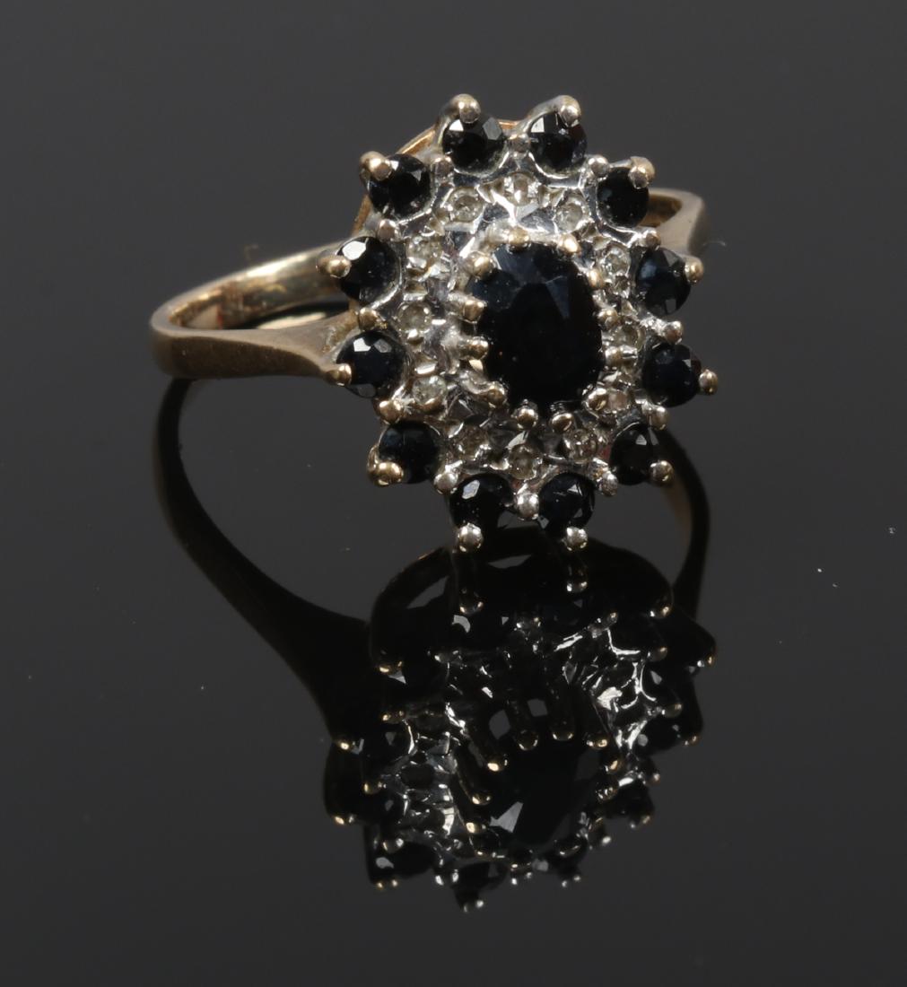 A 9ct gold sapphire and diamond cluster ring, size: A 9ct gold sapphire and diamond cluster ring, size M1/2.