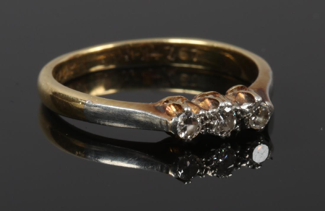 An 18ct gold and five platinum three stone diamond (1 of 1)