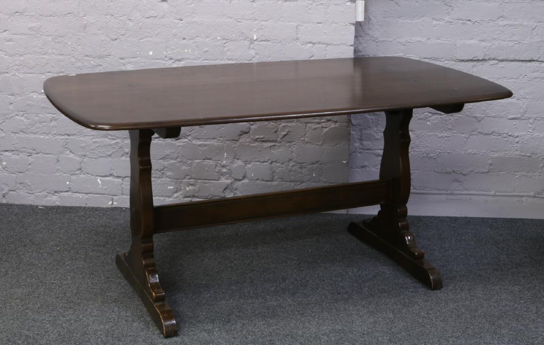 An Ercol refectory table. Height 72cm Width 86cm Length: An Ercol refectory table. Height 72cm Width 86cm Length 153cm.