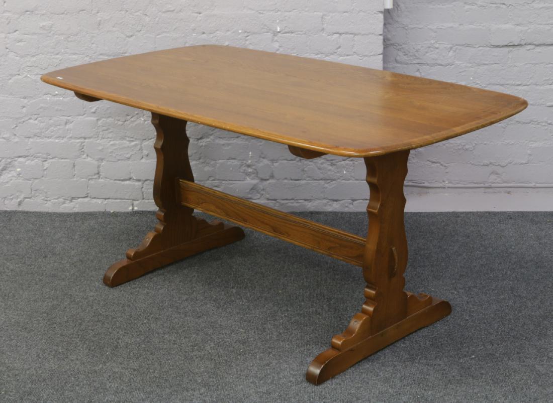 An Ercol Golden Dawn refectory table. Height 74cm Width: An Ercol Golden Dawn refectory table. Height 74cm Width 88cm Length 153cm