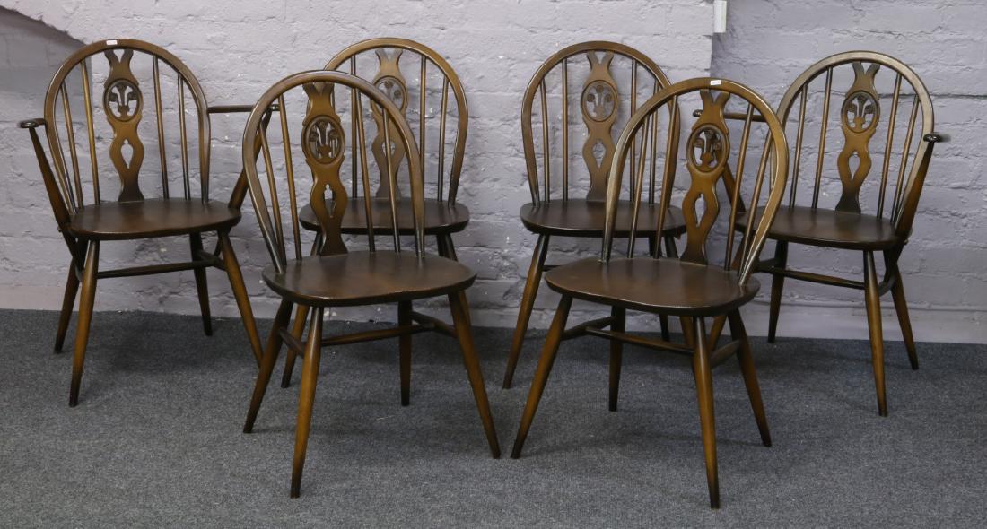 A set of six Ercol Prince of Wales dining chairs to: A set of six Ercol Prince of Wales dining chairs to include two carvers.