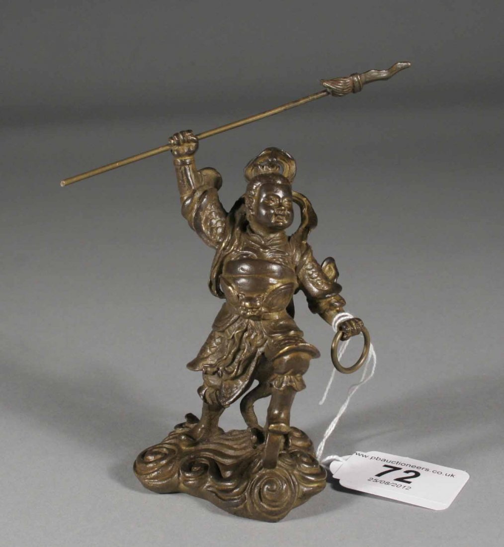 A Japanese Meiji period small bronze figure, formed: A Japanese Meiji period small bronze figure, formed as a charging soldier holding a spear, 5''.