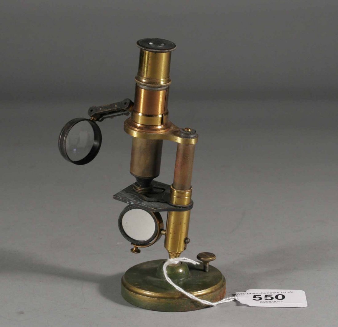 A nineteenth century lacquered brass students trav: A nineteenth century lacquered brass students travelling microscope, 6.5'',